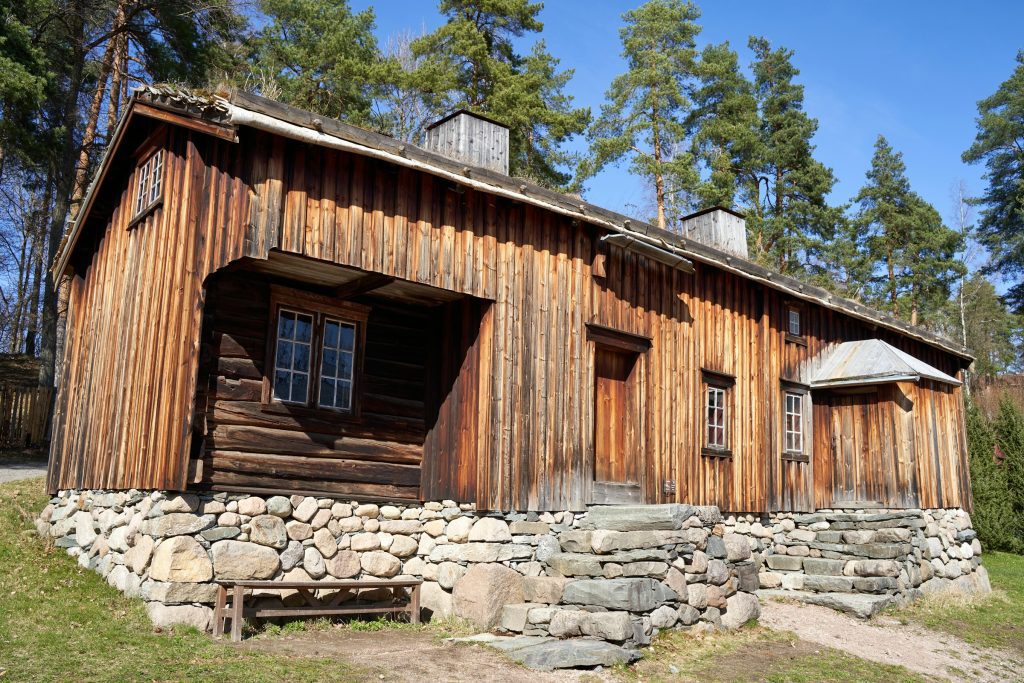 Old wooden home in the woods on stone foundation